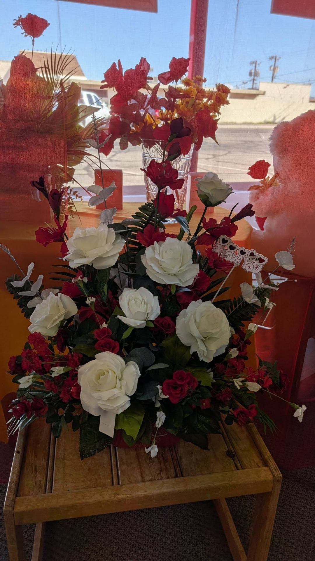 Lush red and white rose arrangement handcrafted at Fascinating Things Flowers & Gifts in Parker, Arizona.